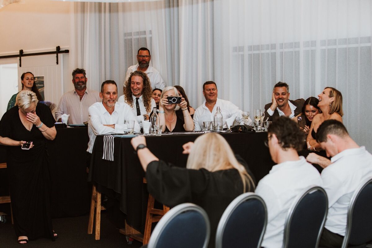Corporate audience laughing during comedy hypnosis show