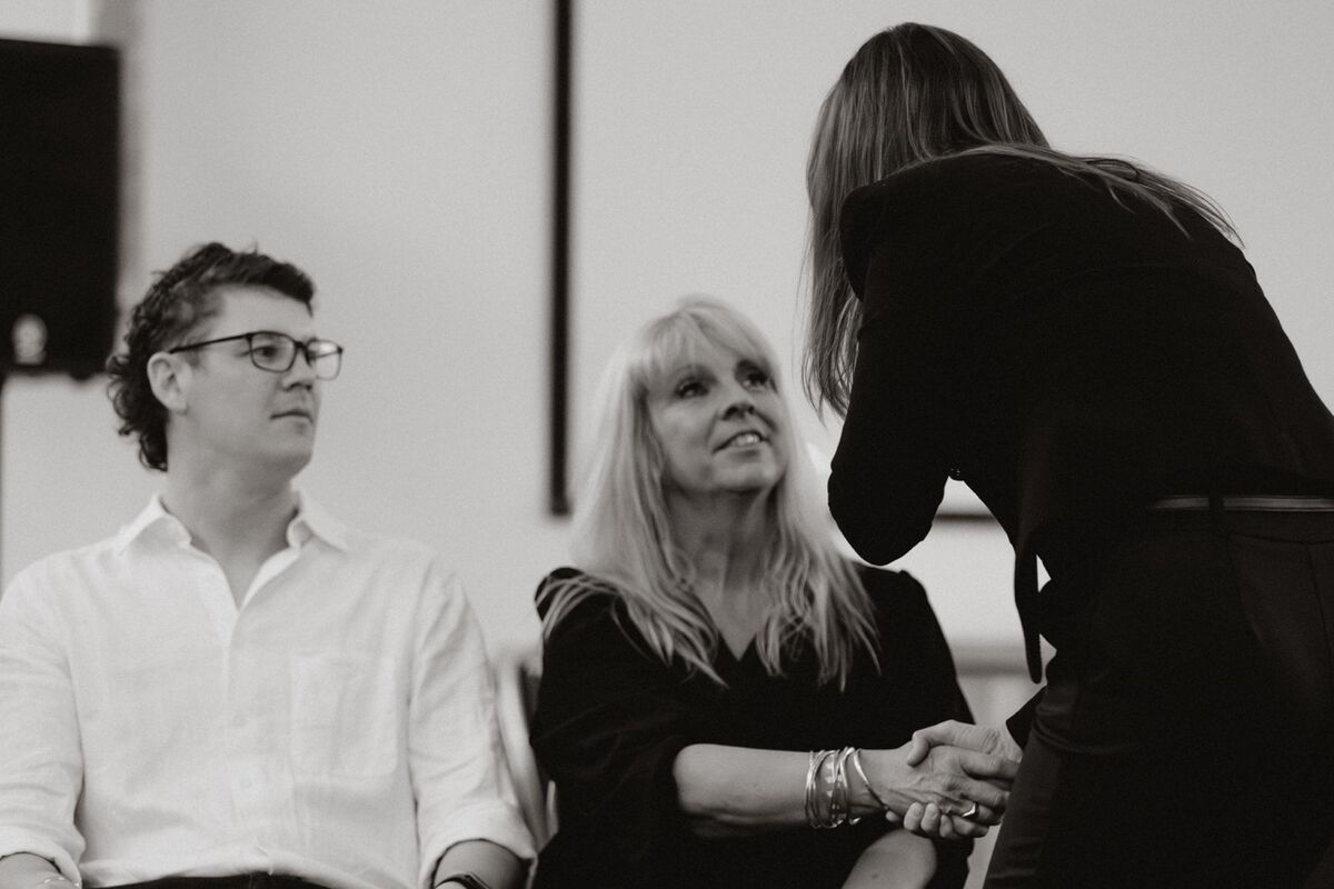 Krystal Brown engaging with volunteers during comedy hypnosis