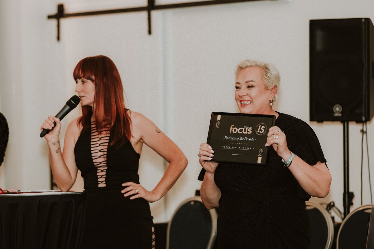 Audience laughing during live comedy hypnosis show